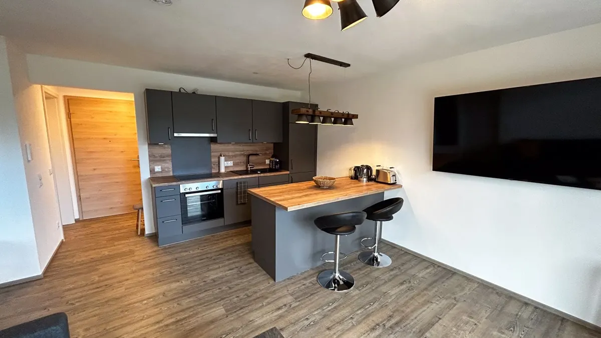 Living room with open-plan kitchen