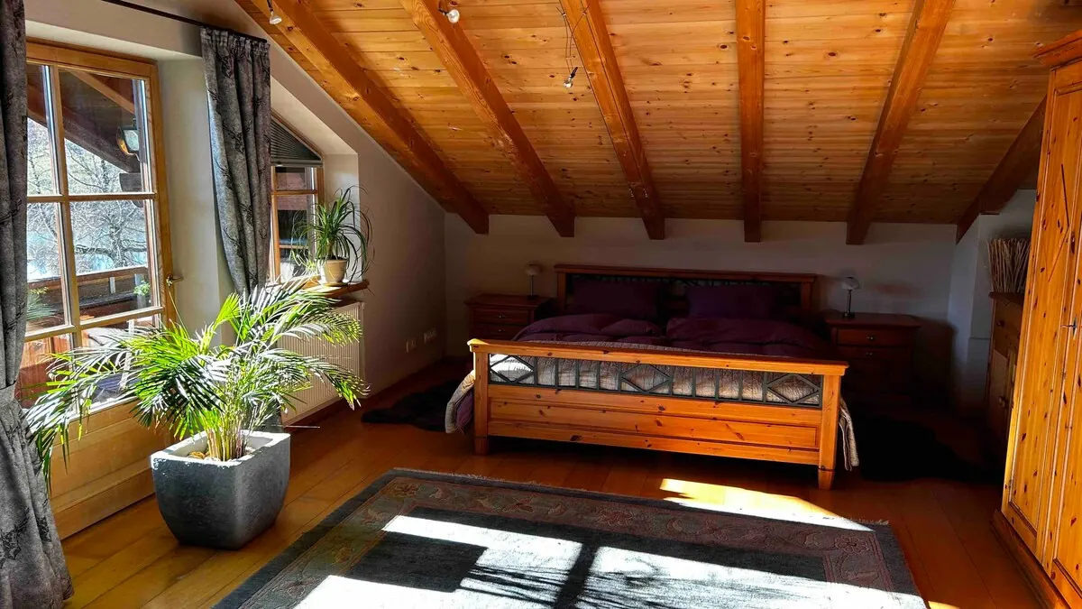 Bedroom with double bed and French window